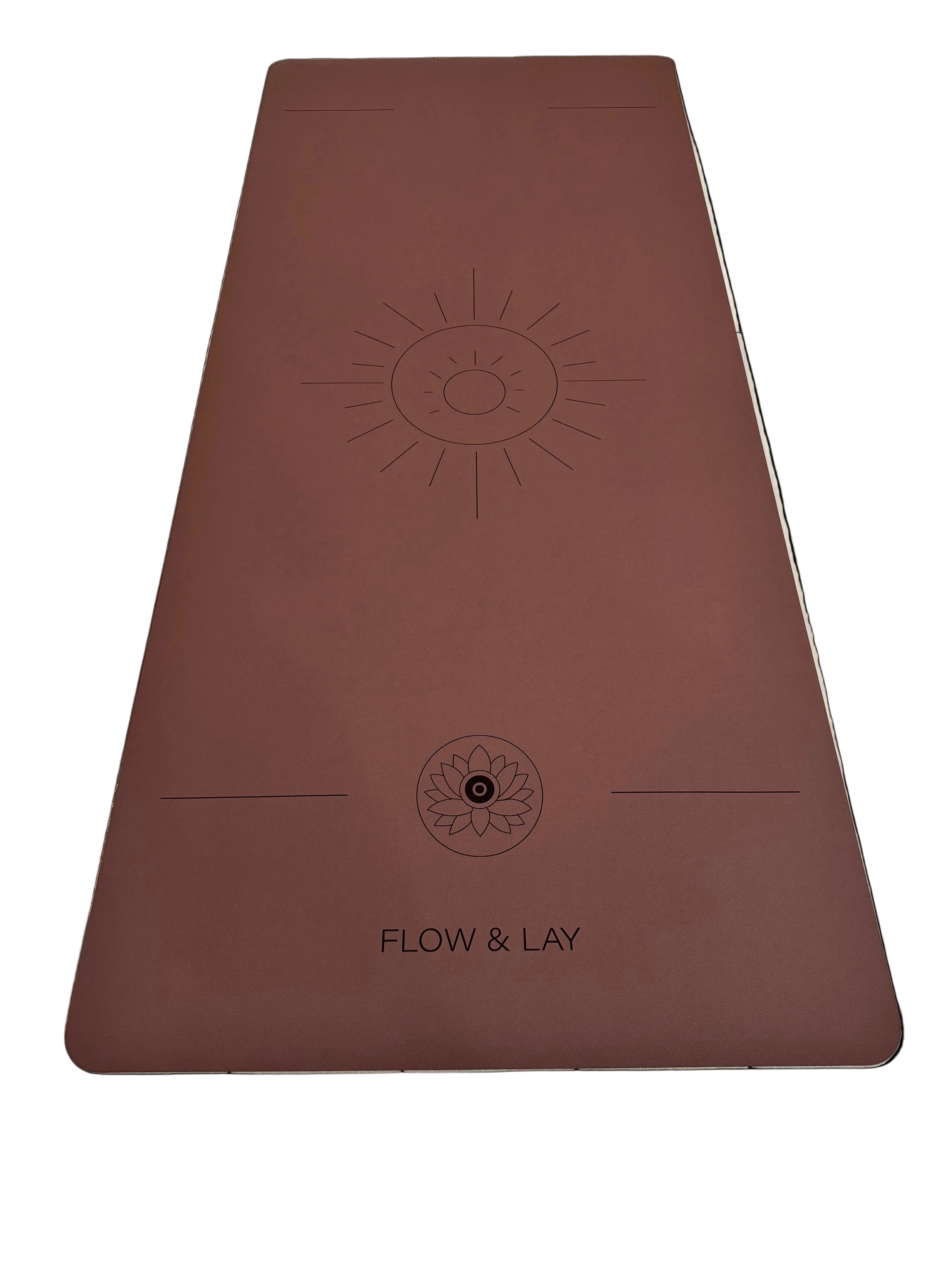 A red rocks Sedona colored extra wide yoga mat with engraved sun design and the text 'FLOW & LAY' at the bottom